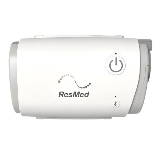 ResMed AirMini travel machine shown from the front with its power button in view.