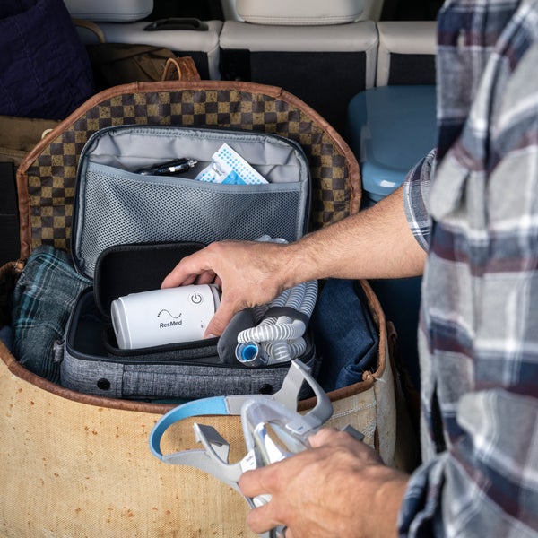 AirMini machine being placed into a hardcase inside of a soft case.