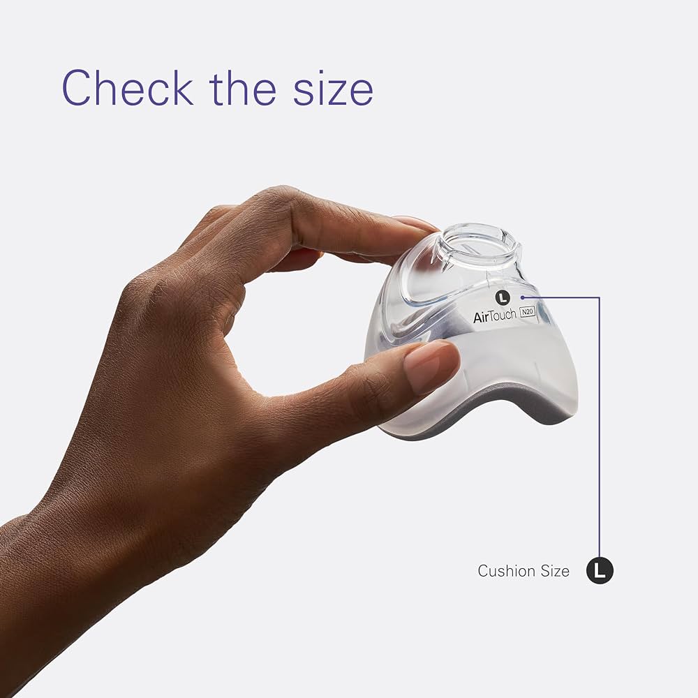 AirTouch Large Cushion being held between fingertips