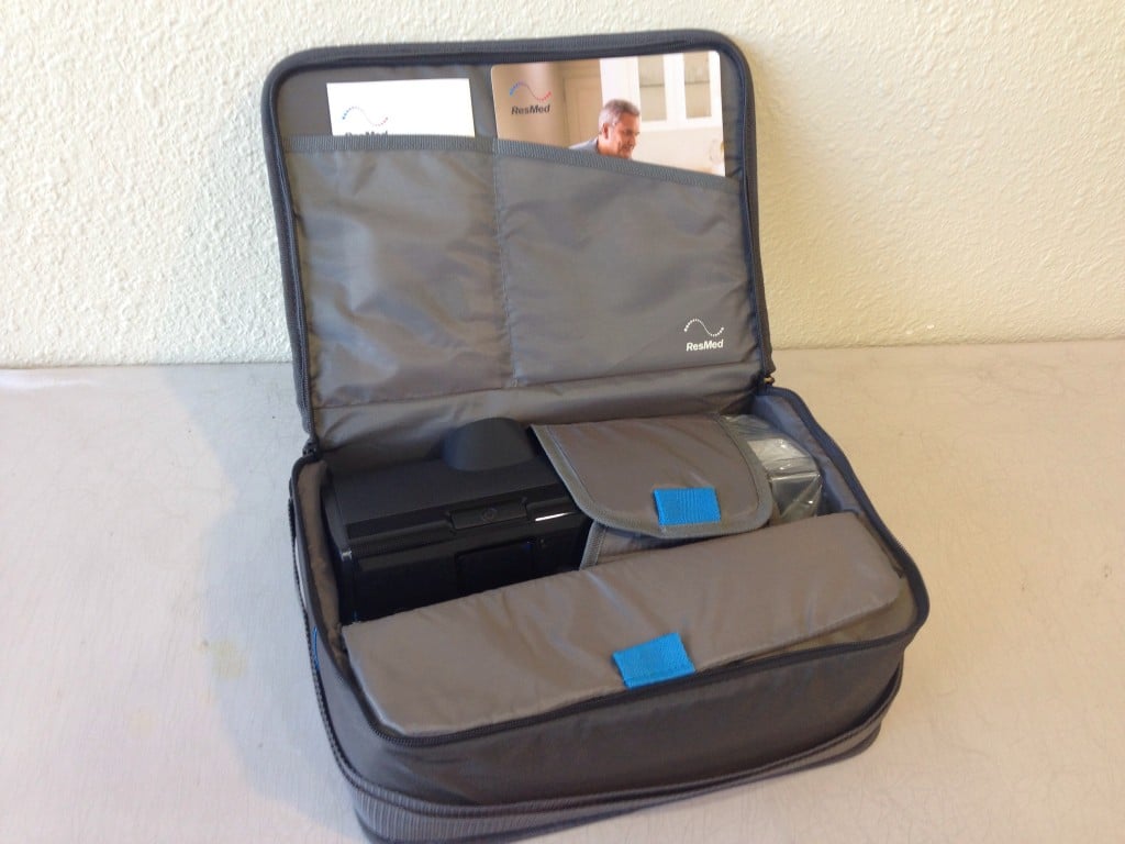 ResMed AirSense 10 CPAP machine inside its travel bag showing its portability.