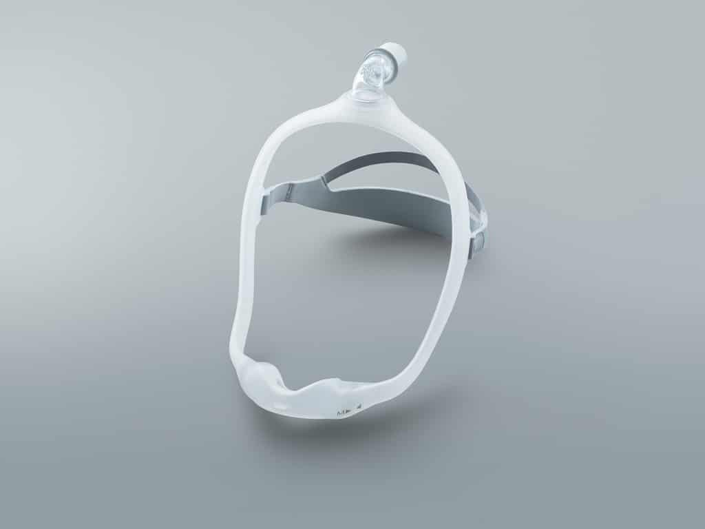 Illuminated silicone frame with adjustable headgear attached to the nasal cradle Dreamwear mask by Philips Respironics
