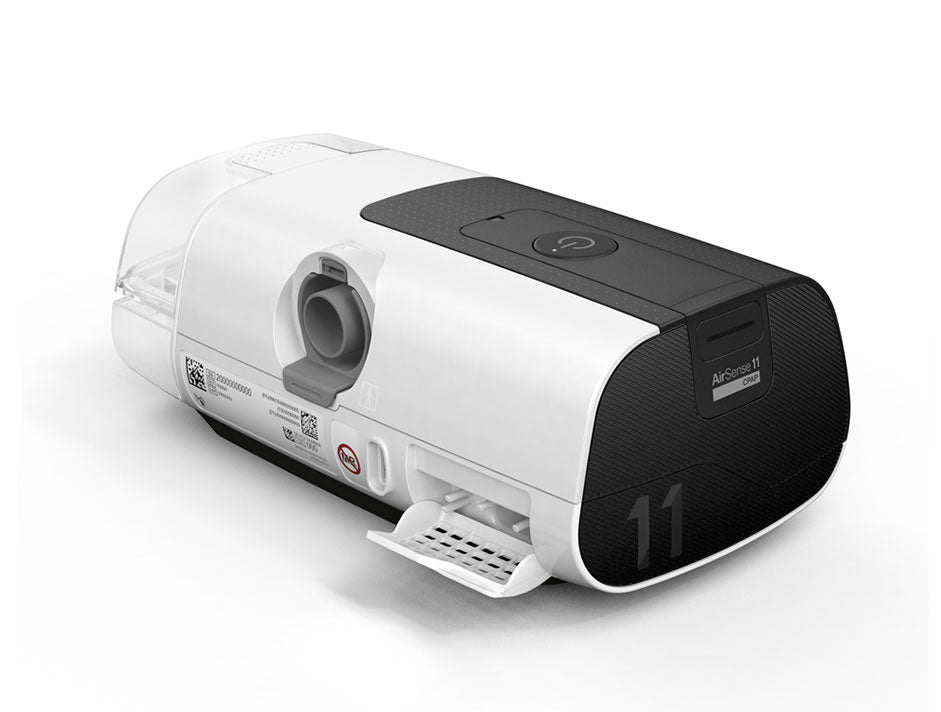 ResMed AirSense 11 AutoSet CPAP machine shown from the back highlighting its tubing connection and filter cartridge.