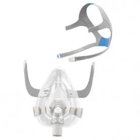 AirFit F20 with frame and cushion attached and headgear disassembled in the background. 