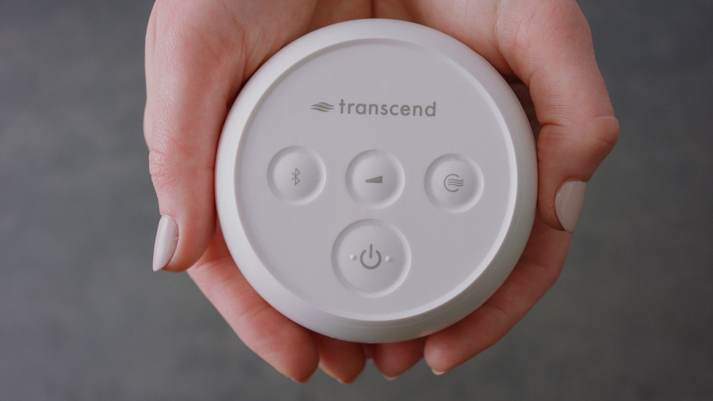 Transcend Micro APAP Machine held in the palms of someone's hands, showcasing its ultra-compact size and lightweight design.