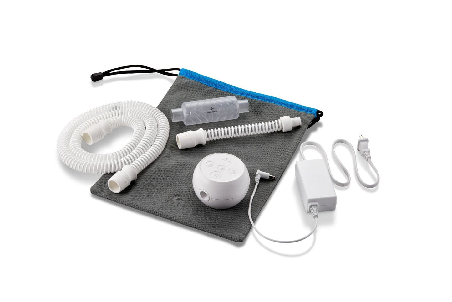 All accessories laid out on a travel pouch, including the Transcend Micro machine, hose, power supply, and WhisperSoft muffler.