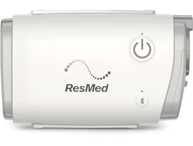 ResMed AirMini - Travel CPAP close up showcasing the logo and power button