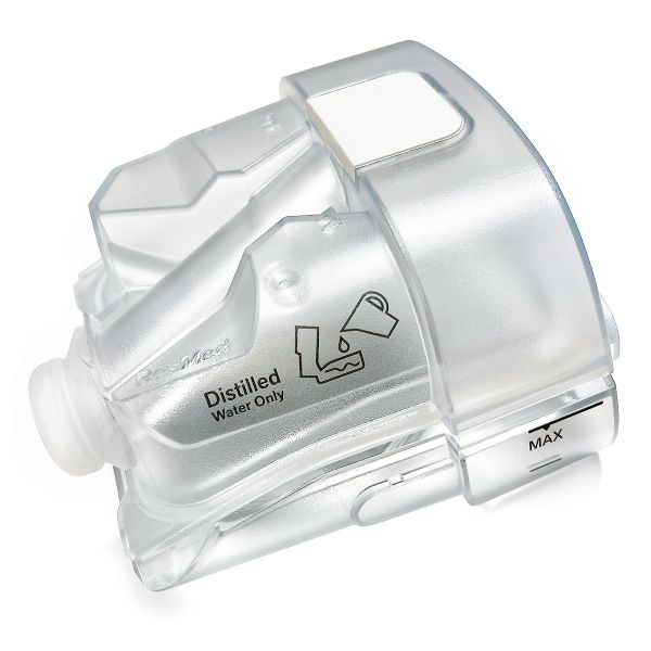 A close-up view of a transparent water chamber designed for a CPAP machine. The chamber is marked with "Distilled Water Only" and a water pour symbol. The chamber is made of clear plastic and has a visible water level indicator labeled "MAX"